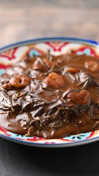 Mexican romeritos with mole sauce and shrimp