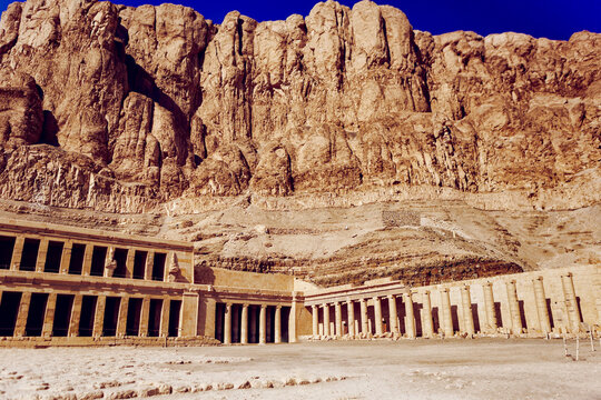 Mortuary Temple of Hatshepsut (Djeser-Djeseru) below limestone cliffs in a desert valley, Deir el-Bahari, Valley of the Kings, Luxor, Egypt