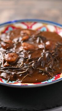 Mexican romeritos with mole sauce and shrimp