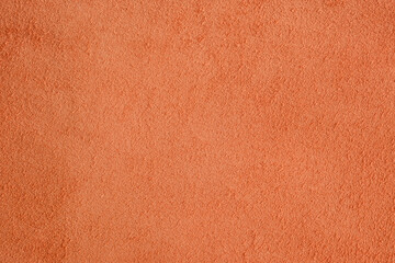 Fototapeta premium Orange leather suede fabric showing a rough and soft textured surface