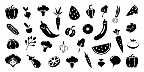 Fototapeta premium Black and white silhouettes of various vegetables and fruits arranged closely