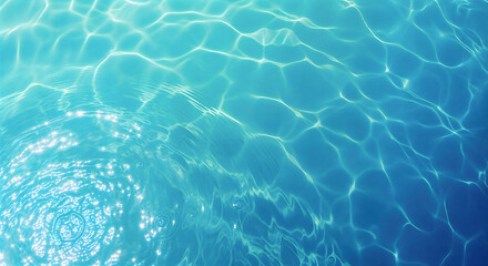 Fototapeta premium Abstract top view of clear turquoise swimming pool water with sunlight reflections and gentle ripples.