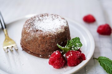 Homemade Chocolate molten lava cake served with raspberries and powdered sugar © vm2002