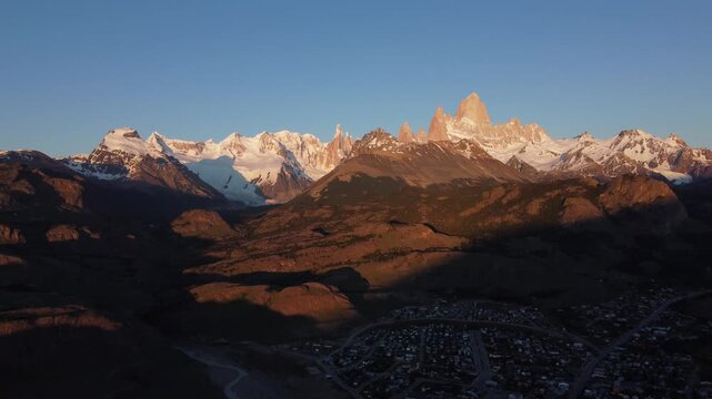 Drone footage of Mount Fitz Roy at sunset, Patagonia. Last light touching granite spires