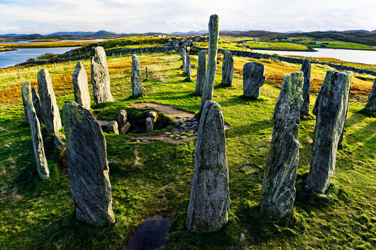 Tursachan prehistoric stones at Callanish, isle of Lewis, Scotland. aka Callanish I. Centre monolith, circle stones and chambered tomb. Looking south