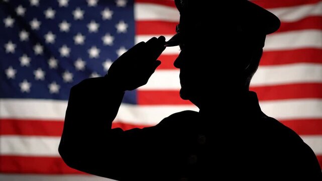Silhouette of a proud american soldier saluting in front of the usa flag. Patriotic concept for memorial day or veterans day. Composite banner of military service and honor