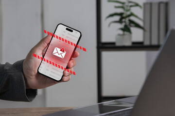 Smartphone displaying email security alert with warning phishing detection interface. cyber attack prevention, spam filtering, data protection and junk and trash mail communication technology.