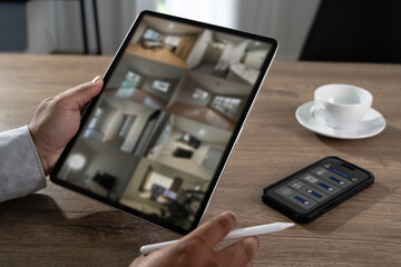 SmartHome Security Monitoring Control Interface Technology Person using tablet for smarthome security monitoring and surveillance control Smart home technology
