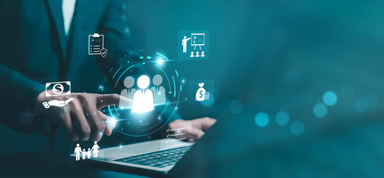 Human resources management concept with businessman selecting employee icon on digital interface. Recruitment, team building, payroll, performance evaluation and business organization strategy.