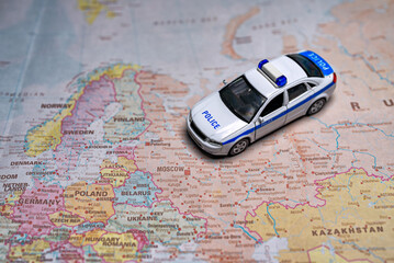 Police car model on map of Russia.