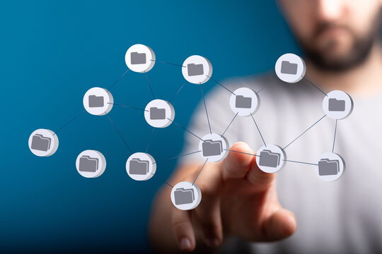 Person interacting with a digital network, data management and technology concept. Represents cloud storage, file shari