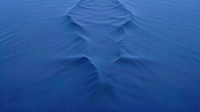 Abstract Deep Blue Fluid Texture with Hypnotic Ripples and Dynamic Flow. Captivating Dark Blue Surface Movement. Serene Liquid Background for Creative Projects.