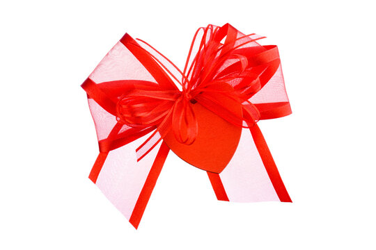 Red ribbon bow with heart-shaped pendant, isolated on transparent background. PNG image.