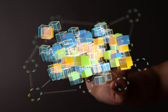 Innovative concept of digital transformation, AI, big data and future technologies represented by cubes and a hand gest