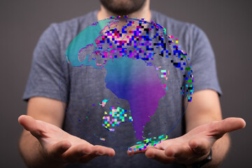 Digitized globe held by a man, symbolizing technology, global connection, and digital world in the...