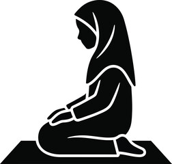 Fototapeta premium Solitude in Prayer: A silhouette of a girl, draped in a modest hijab, deep in solemn prayer, a moment of inner peace and devotion.