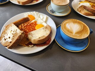 Cafe Brunch Flat Lay with Latte Art, Toast, and Sunny Side Up Eggs