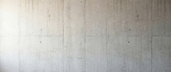 Obraz premium Concrete wall with smooth texture and minimalistic design creating an industrial aesthetic. Concrete wall exemplifies urban architecture for interior design and construction projects.