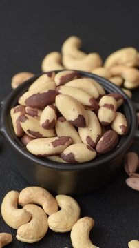 Brazil nuts, raw and shelled, are a source of selenium and a healthy food ingredient. Brazil nuts as a food background for your design