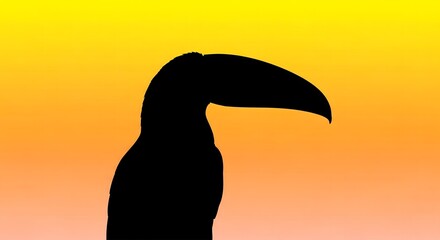 A striking silhouette of a toucan with its distinctive large beak, set against a vibrant yellow and orange gradient sunset sky