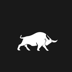Fototapeta premium Powerful White Bull Silhouette with Horns on Black Background