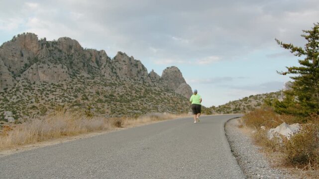 Female Runner with Extra Weight Training on Road in Golden Hour Light for Slim Body Goal
