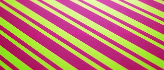 Obraz premium Vibrant diagonal stripes in neon pink and lime green create a bold, energetic pattern