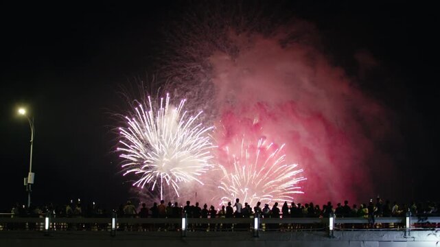 Sparkling Fireworks Bursting in the Sky Over City