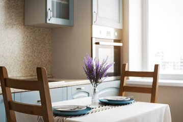 Cozy Modern Kitchen Interior with Dining Table and Natural Window Light