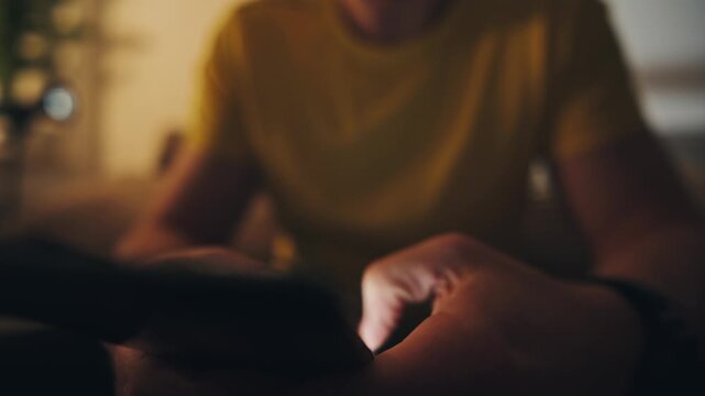 Man Typing A Text Message On Smartphone Screen At Home