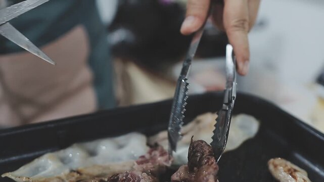 Galbi sizzling Korean BBQ experience showing dynamic cooking action with smoke and grill marks for authentic restaurant scene.