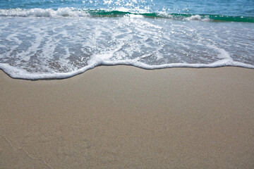 Travel summer background with sea wave and turquoise water.