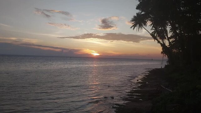 Stunning Tropical Sunset Over the Ocean in Biak, Papua, Indonesia