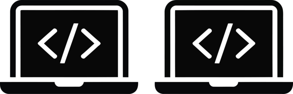 Two laptops displaying code symbols on their screens side by side.