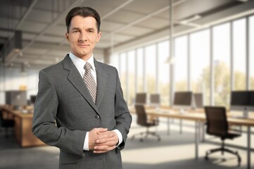 Happy business man looking at camera posing