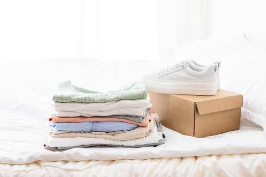 Organized clothes and white shoes