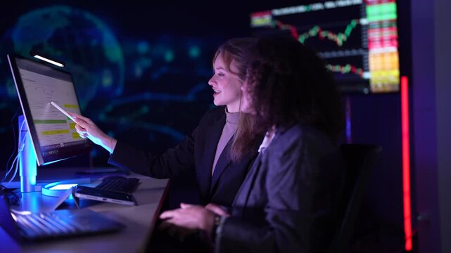 Cybersecurity analysts monitoring real-time network threat logs in dark security operations center. Digital forensic experts auditing malware code syntax during late night shift.