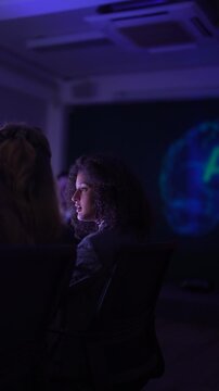 Senior software developers debugging complex backend cloud infrastructure code. Female data science engineers reviewing predictive AI algorithms on digital tablet and monitor.
