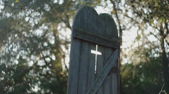 Lens flare through lone church door 
