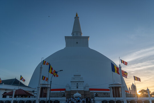 Ruwanweliseya Stupa, Anuradhapura Sri Lanka, White Buddhist Dagoba with Ornate Vahalkada Entrance Facade, Sacred Pilgrimage Temple and UNESCO Heritage Landmark Under Blue Sky, Travel Photo
