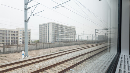 Fototapeta premium Railway Tracks View from a High-Speed Train Window