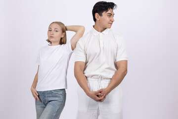 Fototapeta premium Young woman and man in medical uniforms posing together