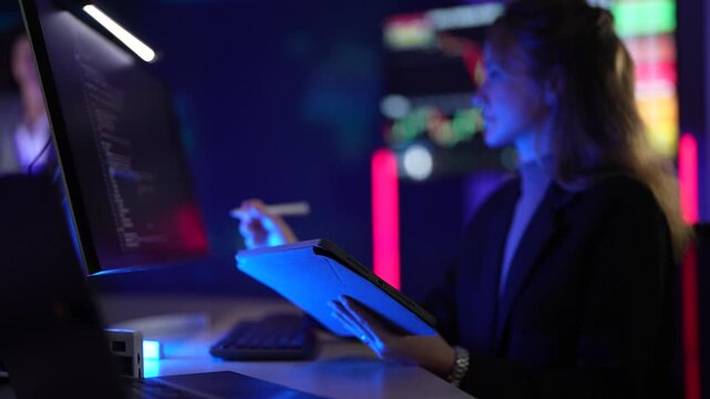 Fintech data scientist developing high-frequency trading algorithms on multi-screen setup. Financial analyst monitoring real-time cryptocurrency market volatility charts.