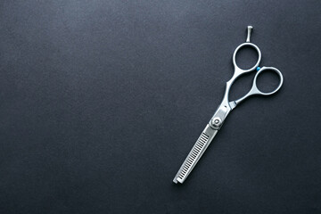 Professional Thinning Scissors on Dark Background with Copy Space