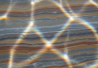 Spectral refractions dance across the textured, layered earth surface view