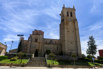 Santa Maria la Mayor church in Villamuriel de Cerrato with Romanesque apse and bell tower
