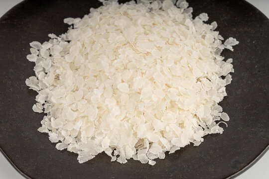 Raw flattened rice. Dry rice flakes or poha, Indian breakfast food