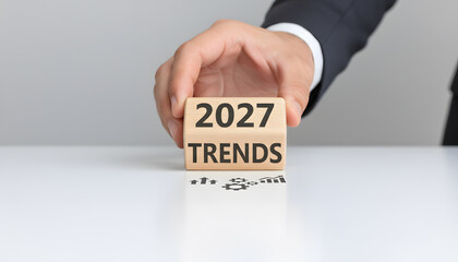 2027 Trends Wooden Block Held by Businessman Hand Symbolizing Future Business Growth Strategy and Innovation