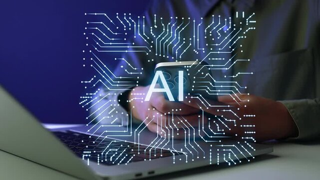 Using a smartphone with AI technology while working on a laptop in a modern office setting during the evening.