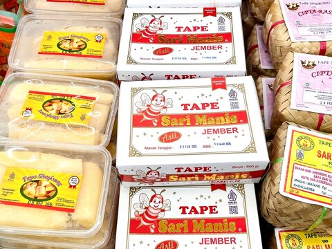 Jakarta, Indonesia - February 25th, 2026 - Tape or fermented cassava food box packaging isolated on horizontal ratio background.